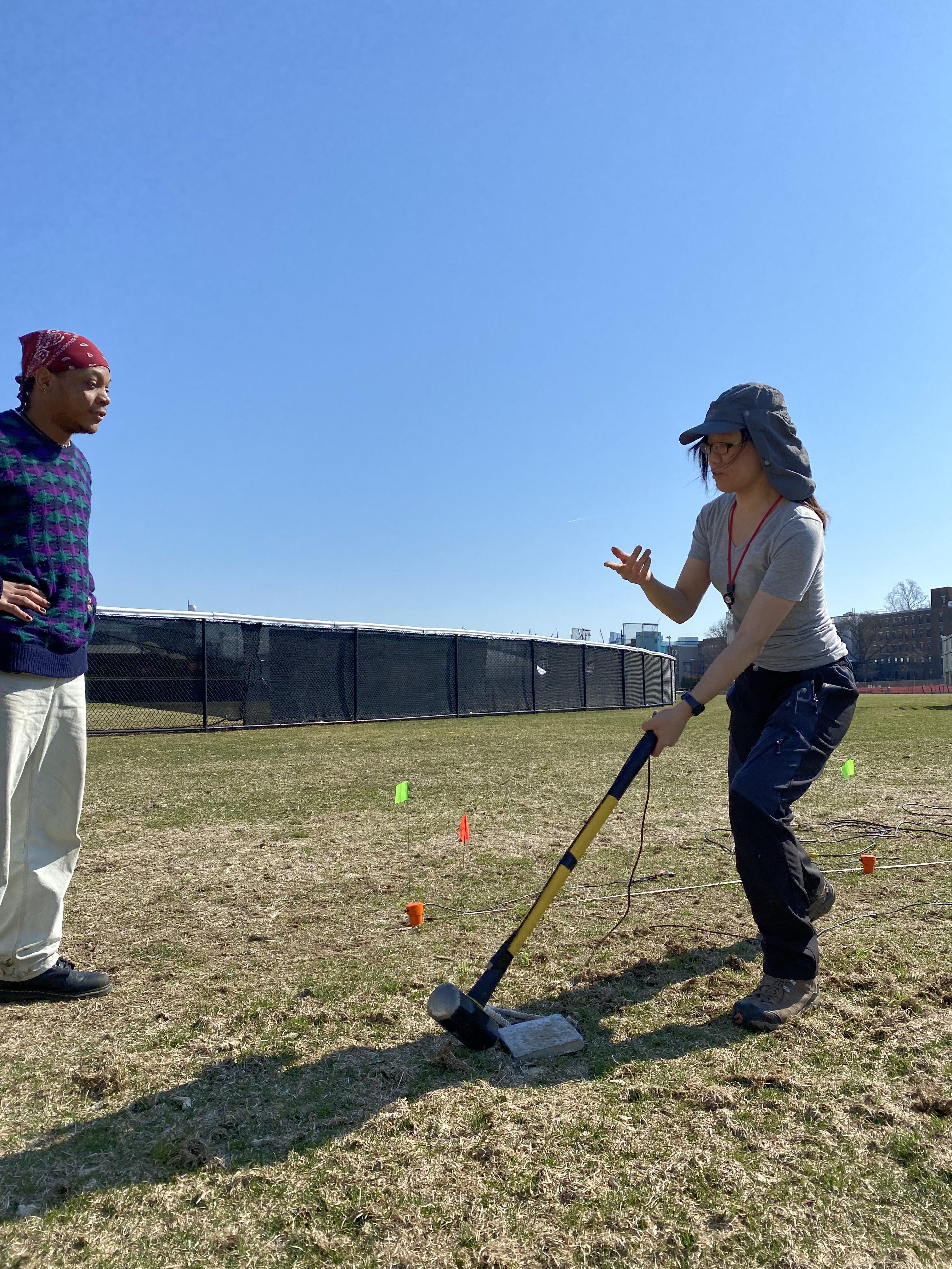 Fig 2. Performing a geophone survey on campus (left to right: Denzel Segbefia, myself). Picture credit: Congcong Yuan.