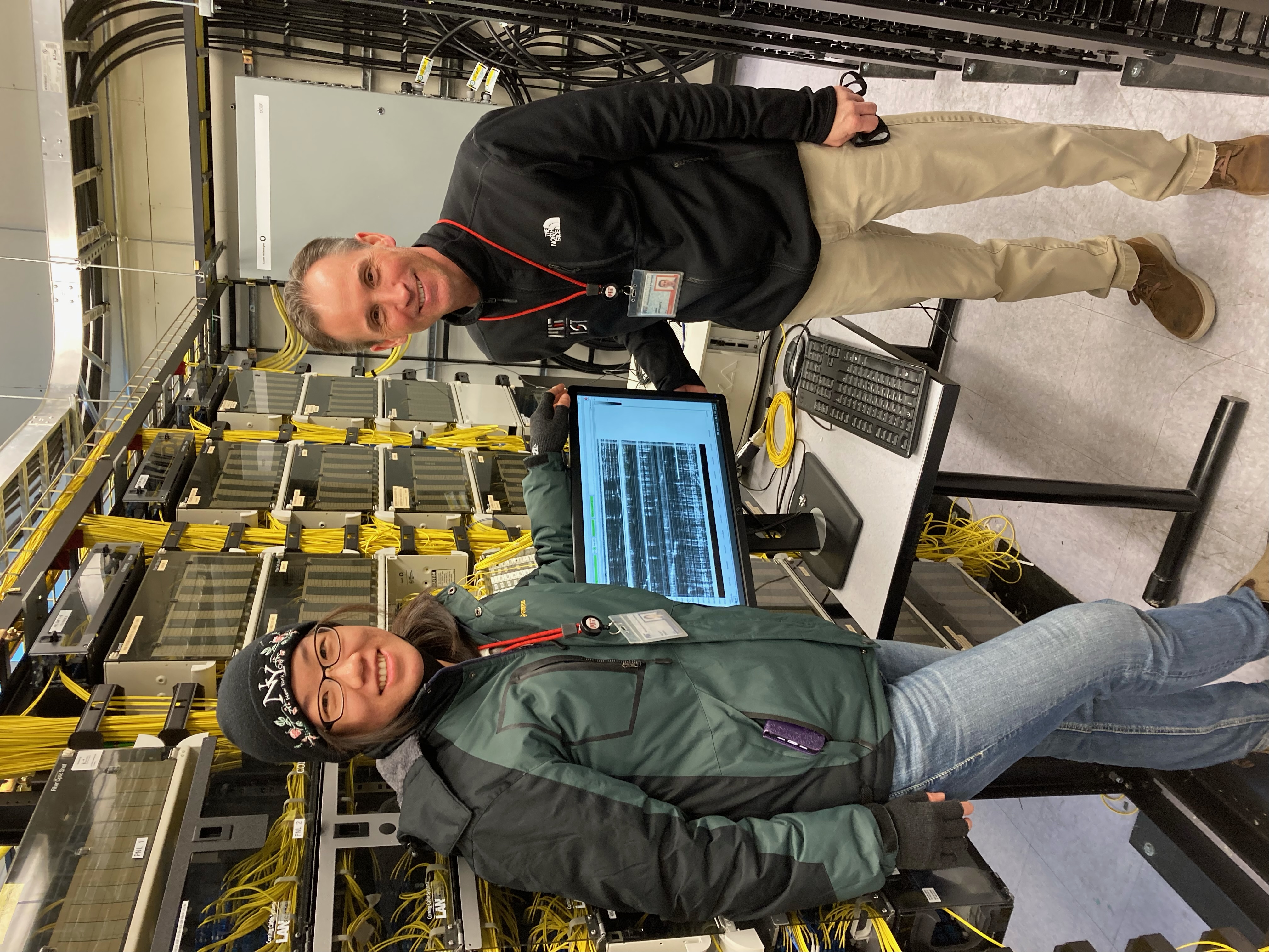 Fig 3. Conducting a seismic experiment using the telecom cables on campus (left to right: myself, John A. Morgante).